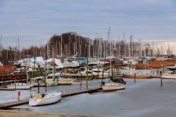 stock-photo-small-private-yachts-pier-in-winter-small-private-boats-in-foreground-with-deep-blue-water.jpg